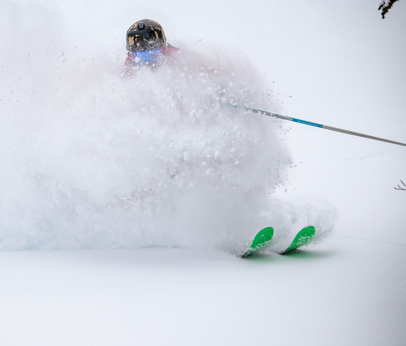 Skier riding in powder.